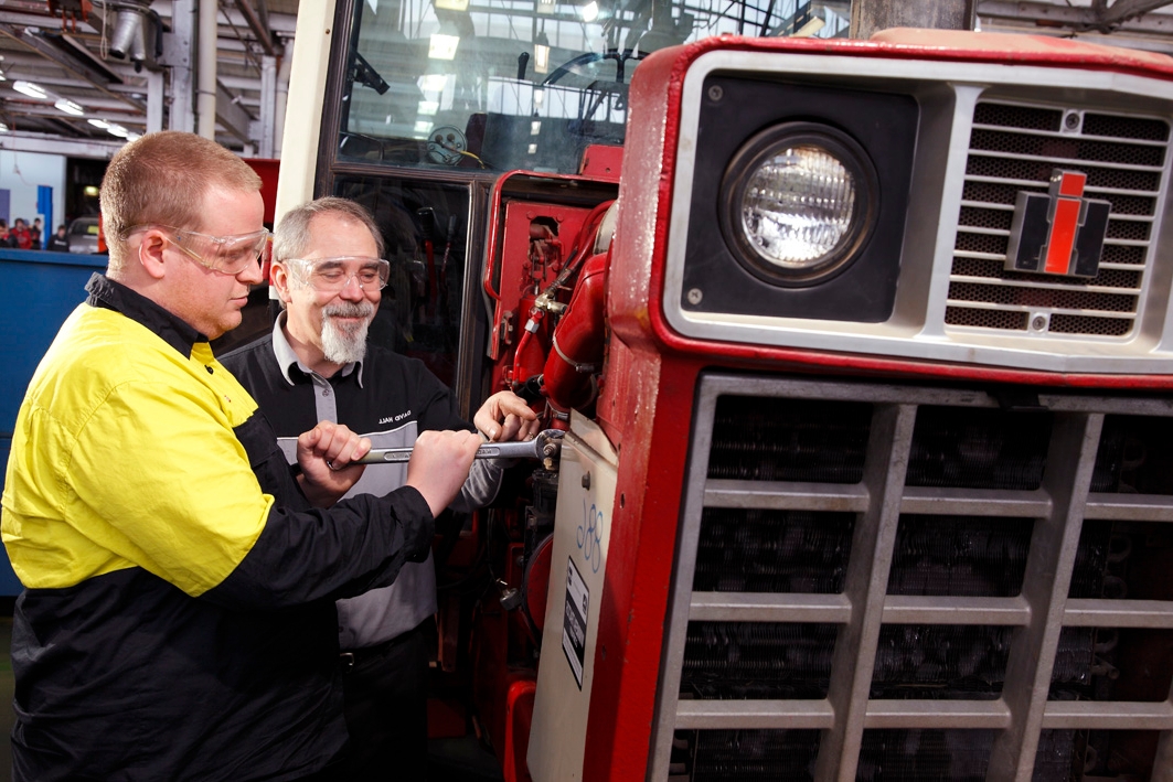Automotive teacher with student