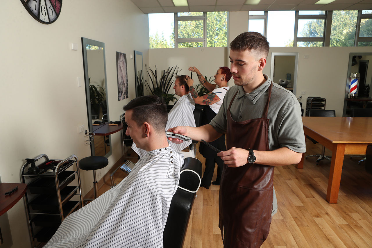 Male barber cutting hair