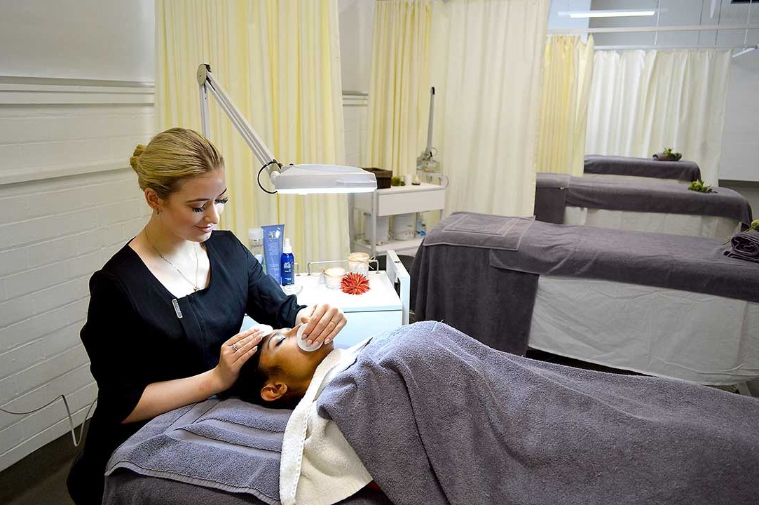 Female student providing beauty service