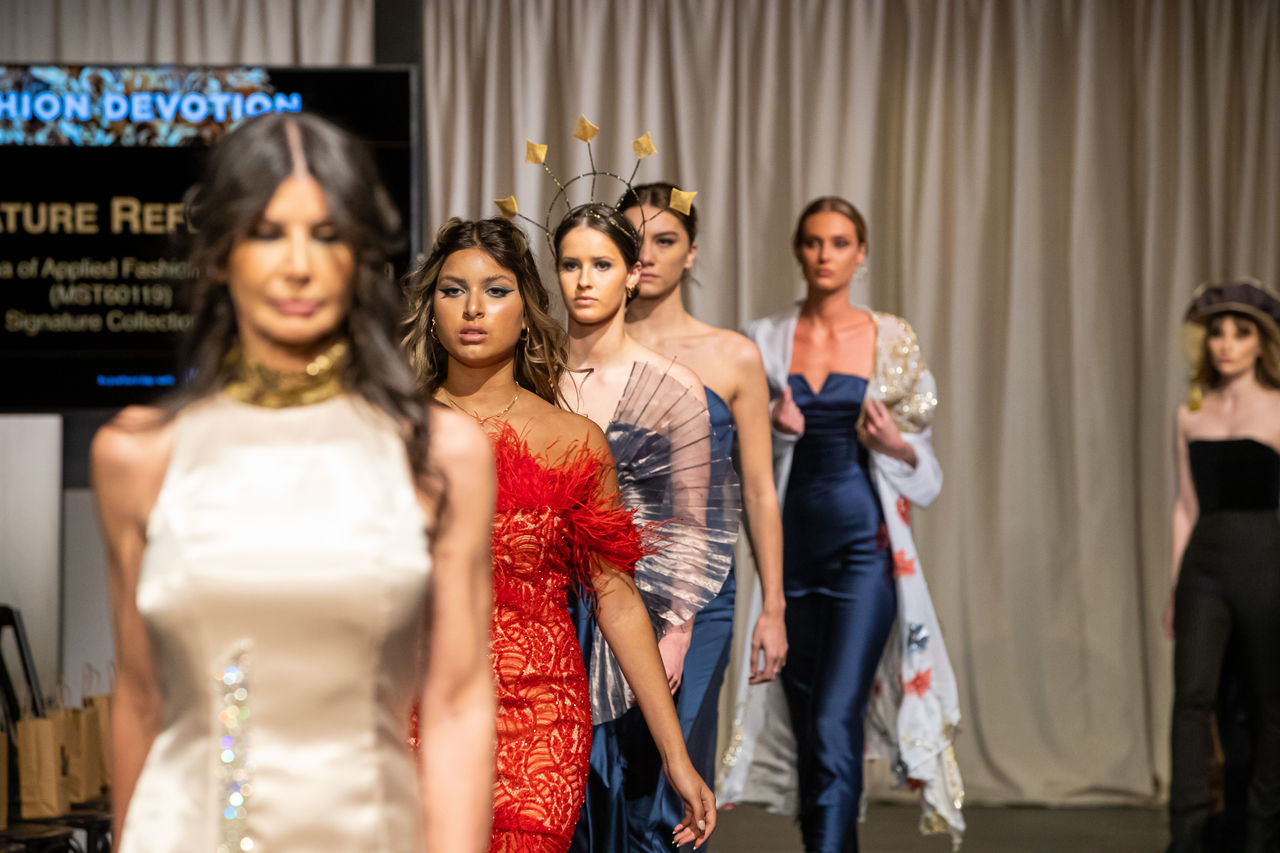 Models n catwalk wearing student designs