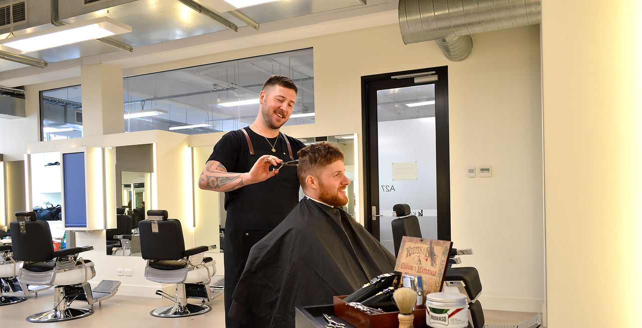 Male barber cutting hair