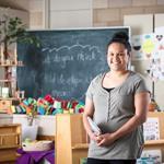 female standing in classroom