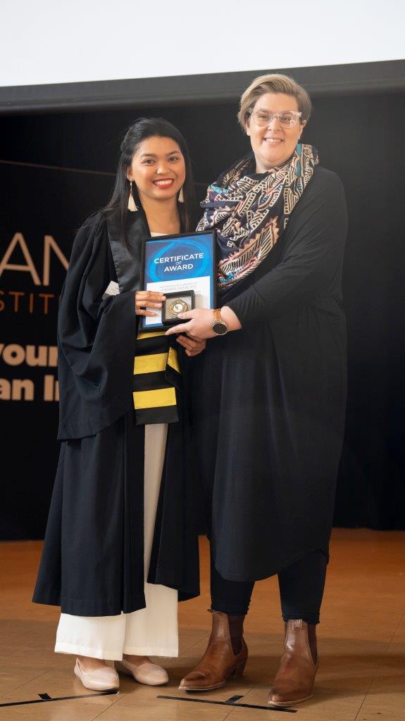 Kangan institute student receiving award during graduation ceremony