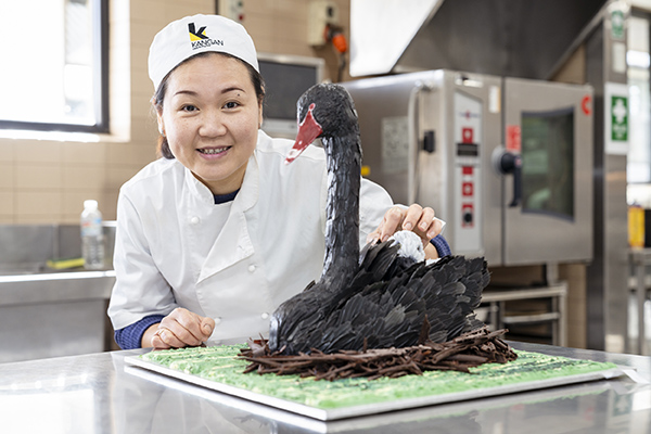 Baking student Thi with award winning cake