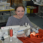 female with sewing machine