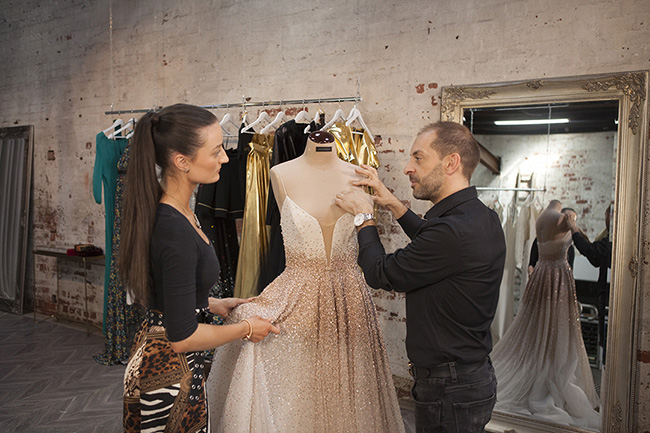 Fashion students creating a wedding gown 