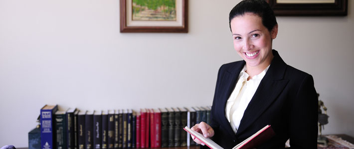 Female lawyer holing a book 