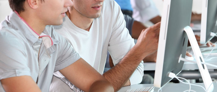 people looking at computer