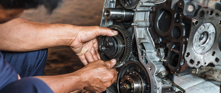 Mechanic working on engine 