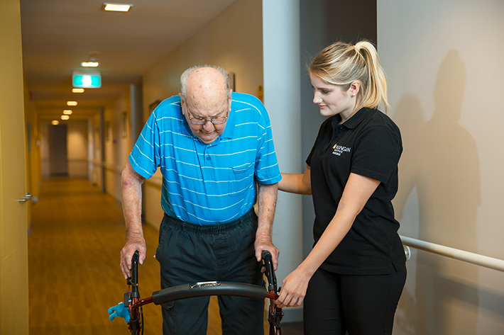 Aged care support worker helping  senior citizen 