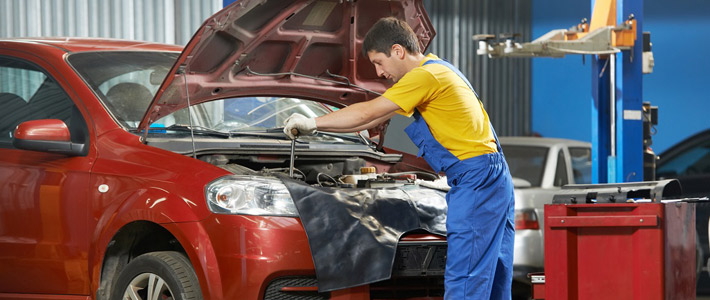 Man working on car engine