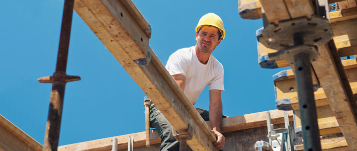 Worker installing structural beam