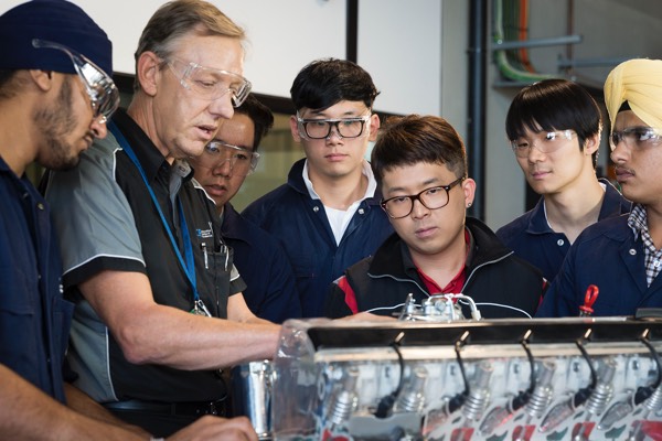 Teacher with automotive students