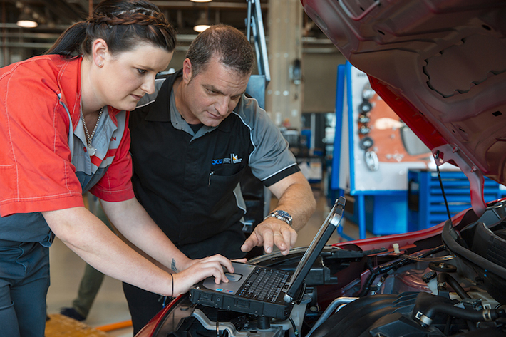 Auto student working a car 