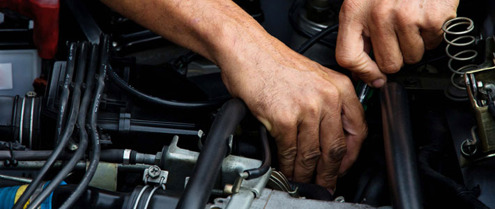 Hands working on engine