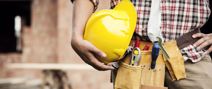 Construction worker hard hat and tool belt