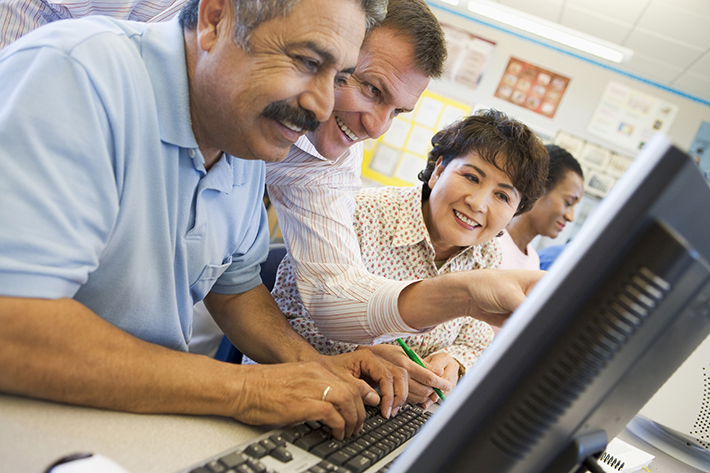 Mature students learning computer skills