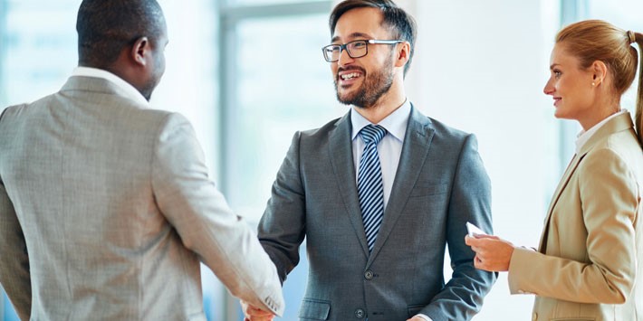 Man in suits shaking hands