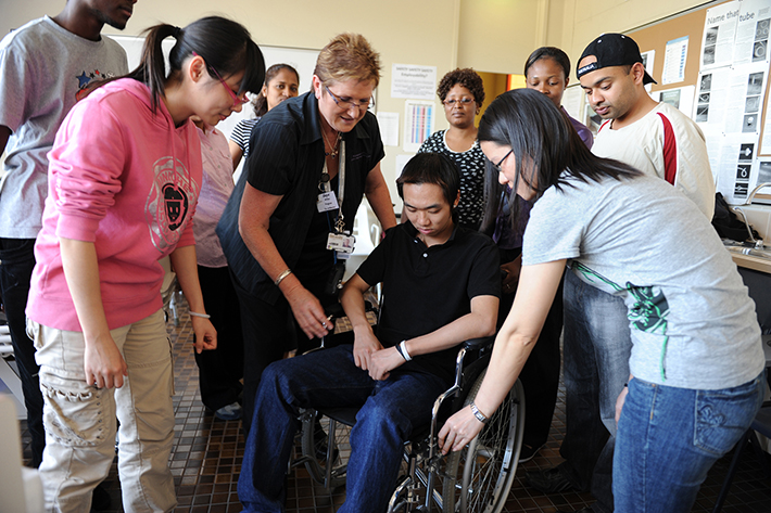 Physiotherapist  teaching students 