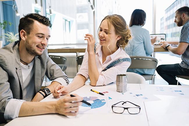 Woman and man in office working together