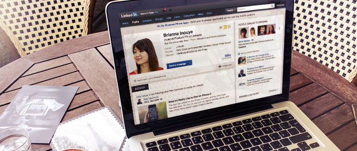 Image of a laptop open and displaying a LinkedIn profile 