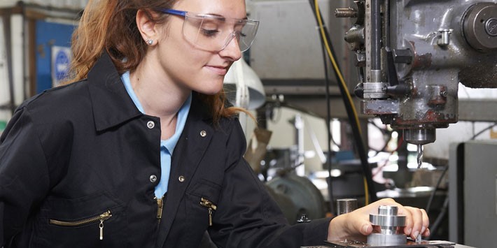 Female tradesperson with protective eyewear on 