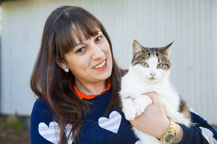 Female holding a cat