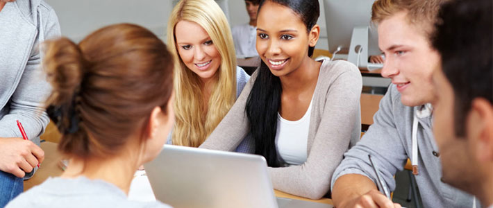 A group of students sitting together collaborating 