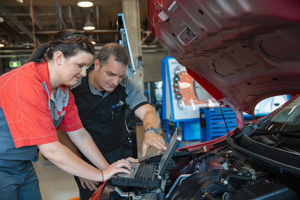 Auto student working a car 