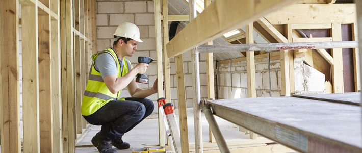 Construction worker with drill