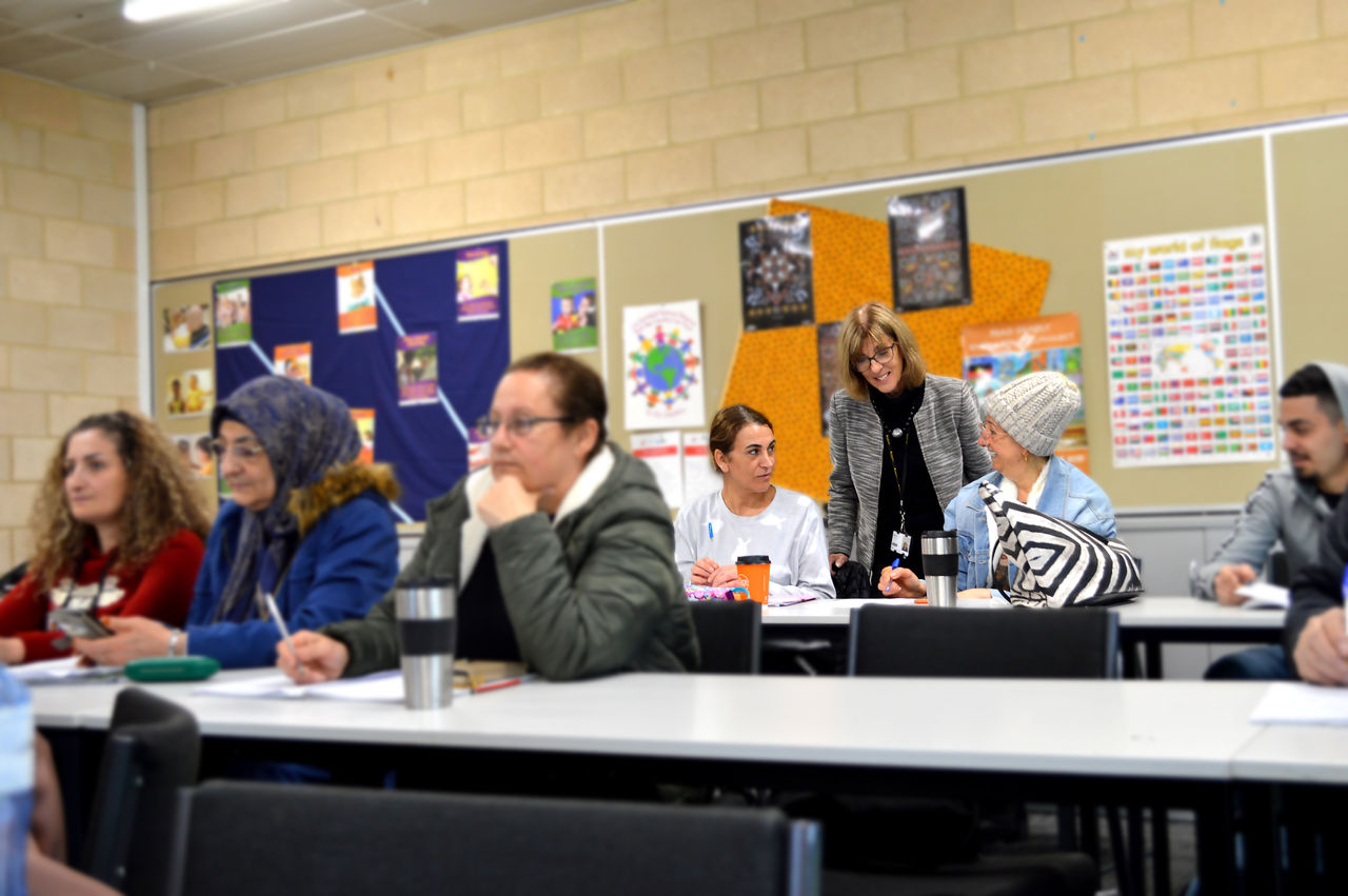 Female teacher with young children in a classroom